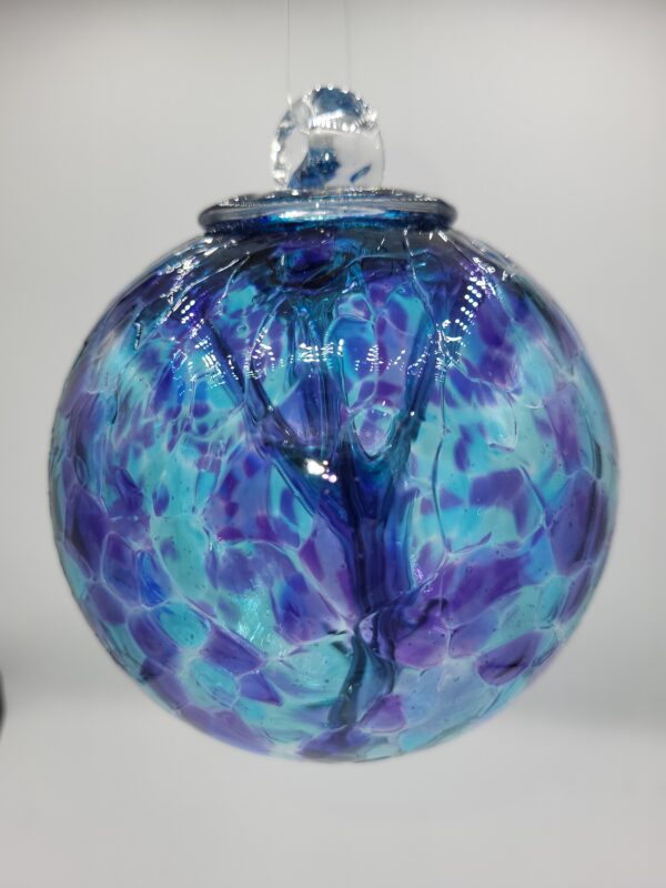 Blue and purple glass ornament with bubble design.