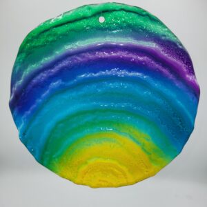 Colorful circular resin art with gradient layers