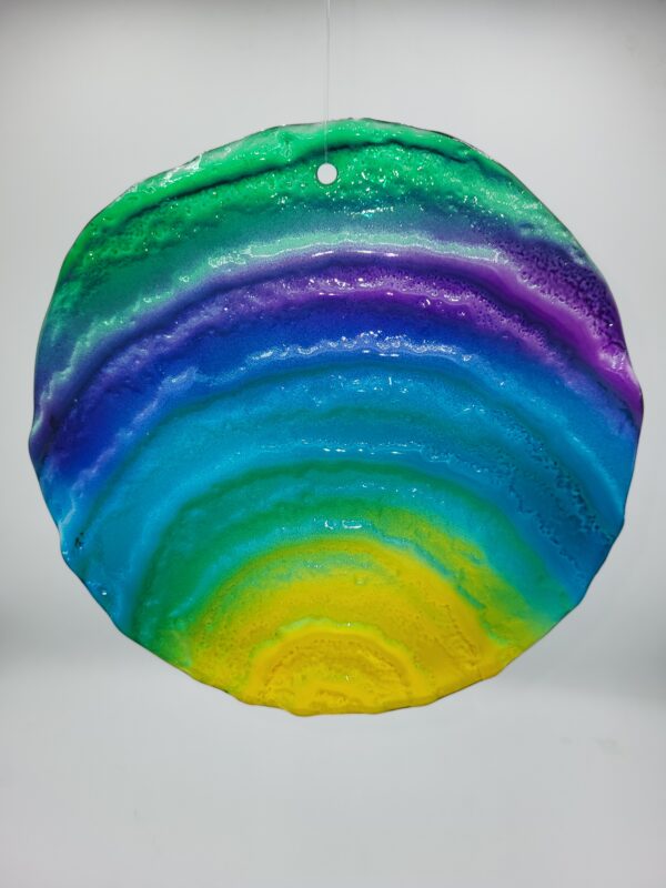 Colorful circular resin art with gradient layers