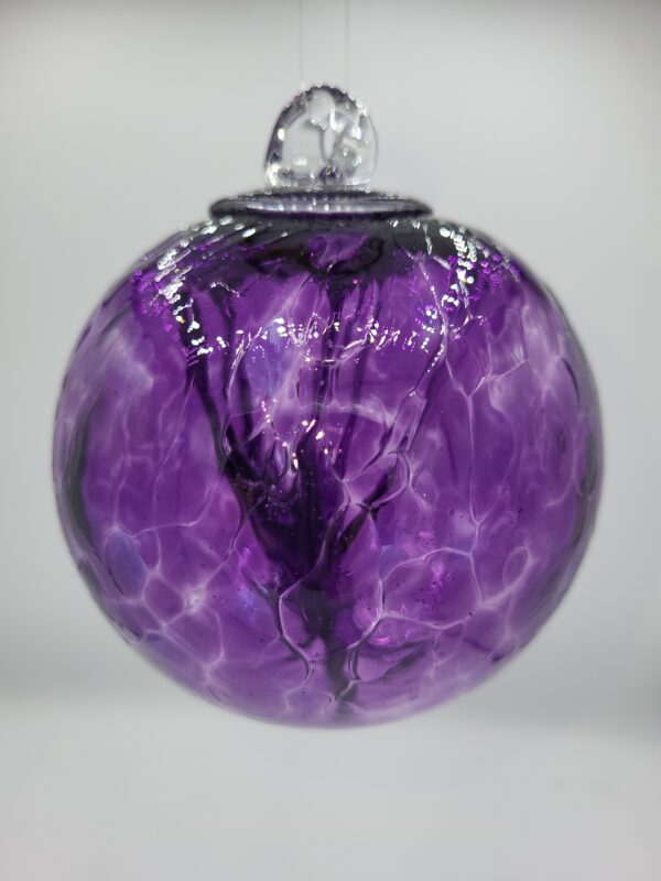 Close-up of a purple glass ornament.