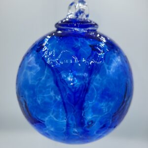Blue glass ornament with textured surface.