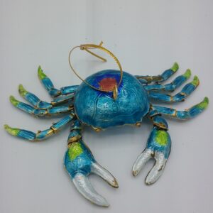 A blue and green decorative crab ornament with metallic claws and legs, featuring a golden string loop attached to its back, displayed on a plain white background.