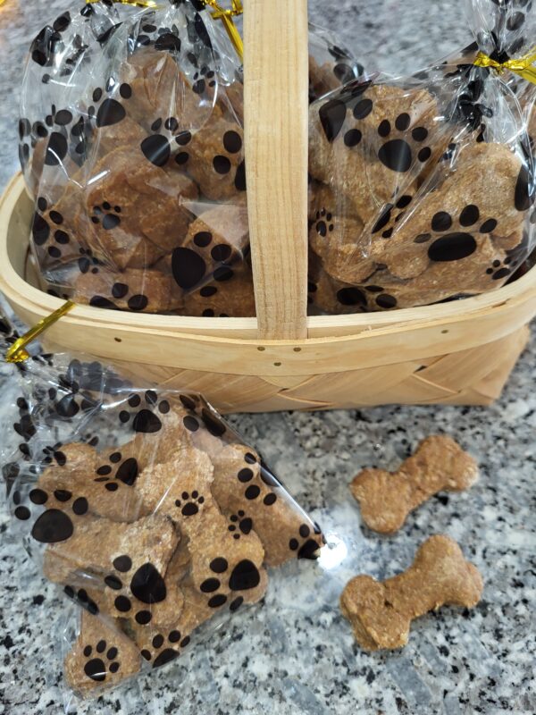 Basket of packaged dog bone treats on counter.