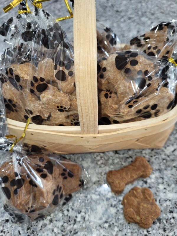 Basket of homemade dog treats in paw print bags
