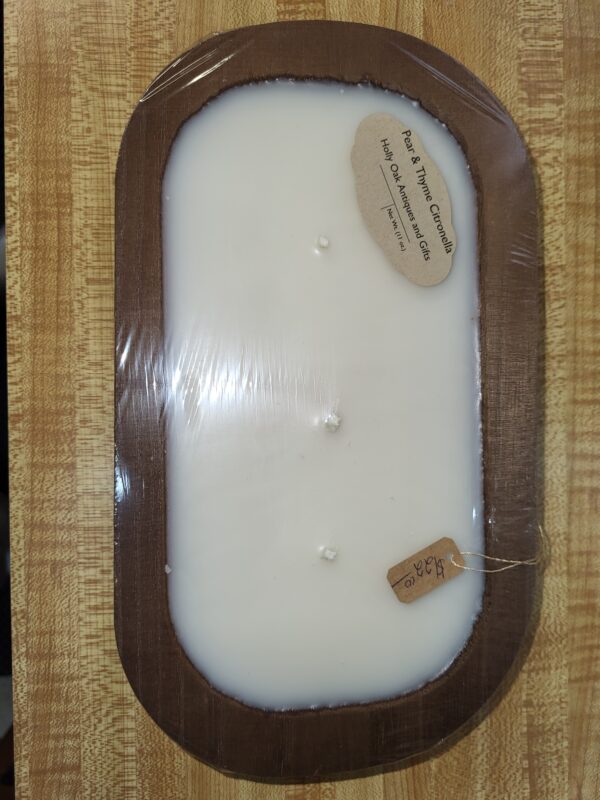 Pear and Thyme Citronella candle on wood tray.