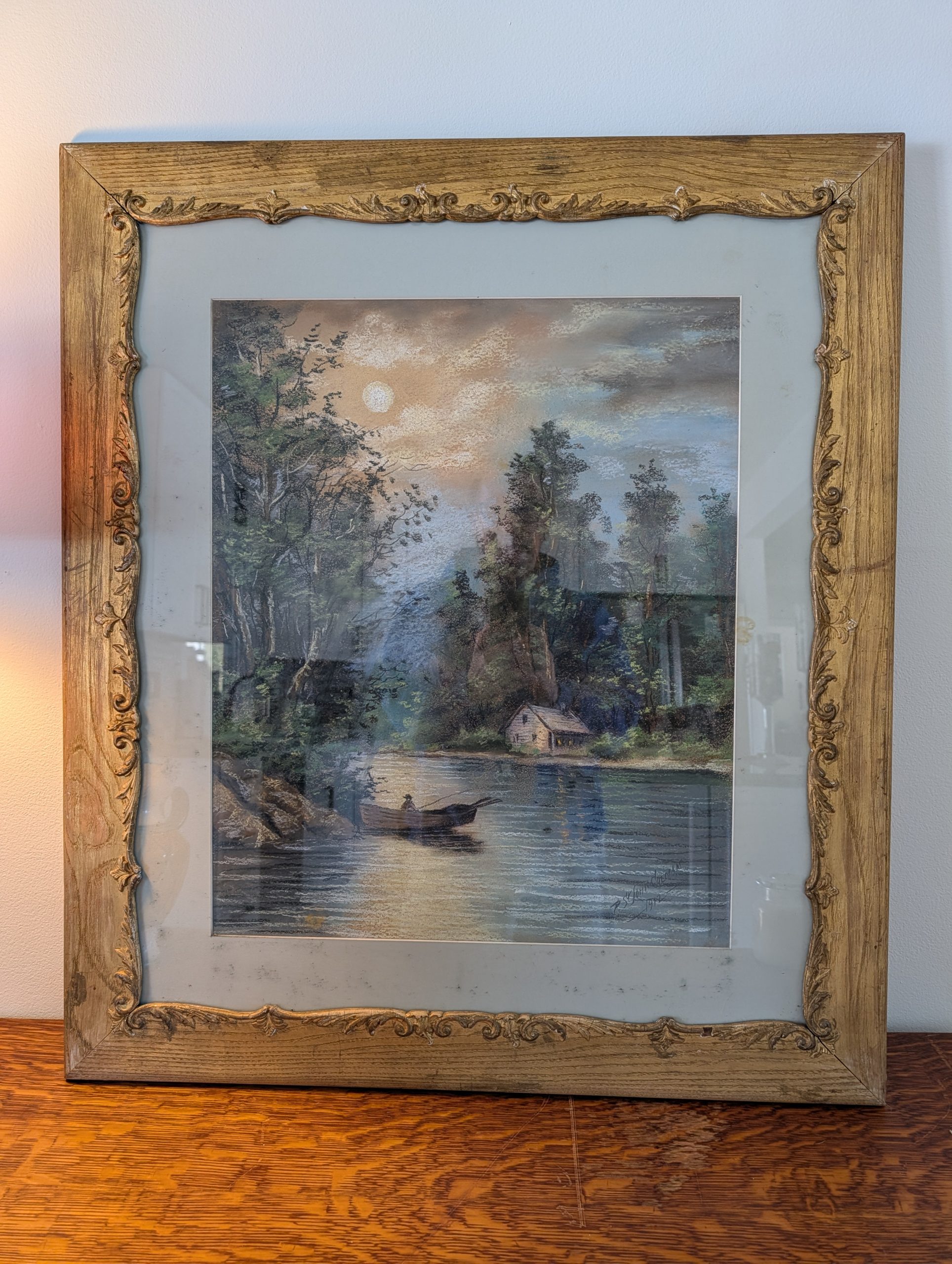 Framed landscape painting with water scene